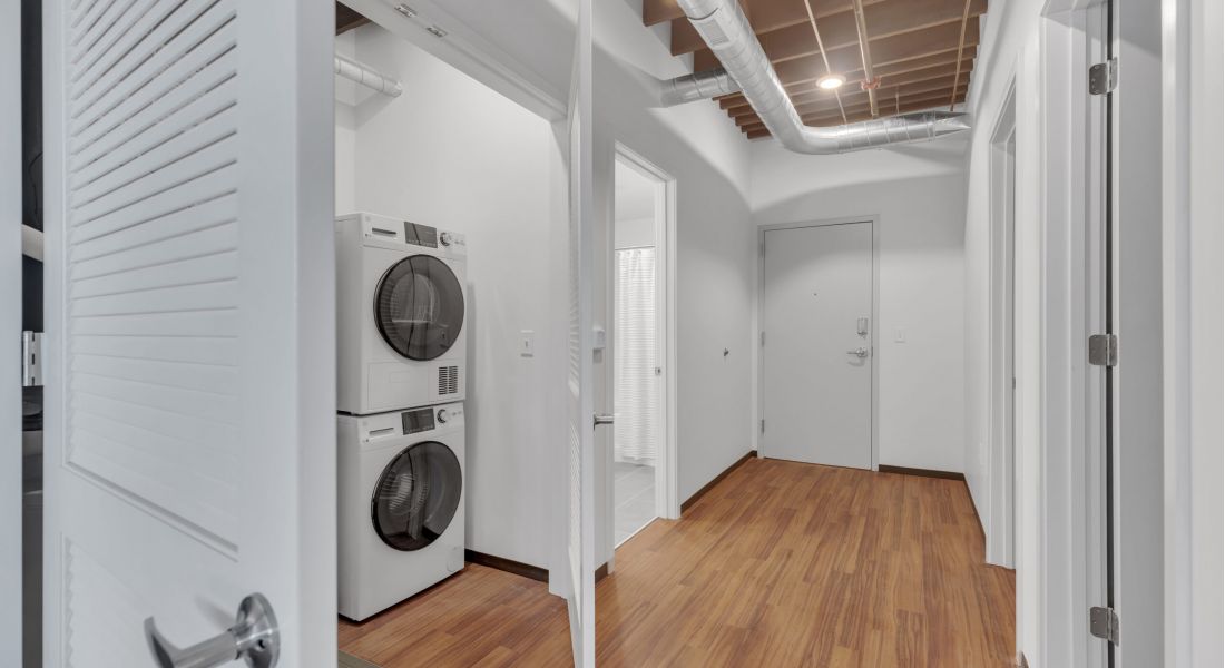 West Bottoms Flats apartment interior hallway with in-unit washer and dryer