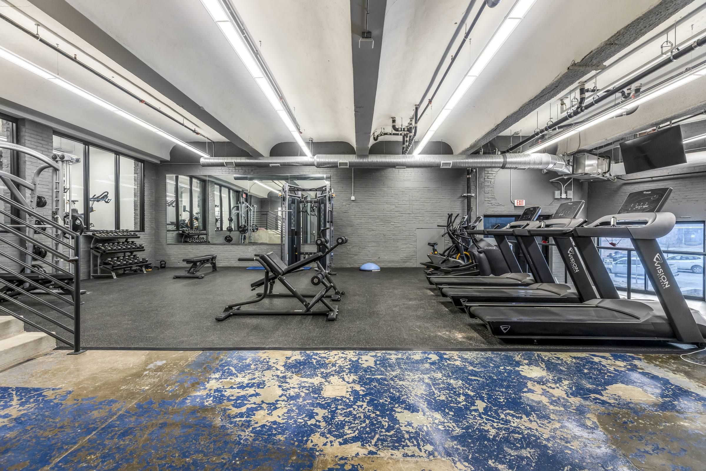 West Bottoms Flats fitness center featuring urban core style and including cardio machines and wieghts